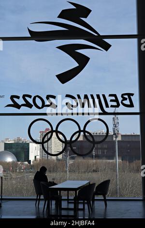 Beijing, China. 28th Jan, 2022. A member of the media relaxes at the Main Media Center as the city counts down to the opening of the Winter Olympics in Beijing on January 28, 2022. Blue skies and cold temperatures are welcoming athletes to a city under lockdown to prevent the spread of Covid-19. Photo by Richard Ellis/UPI Credit: UPI/Alamy Live News Stock Photo