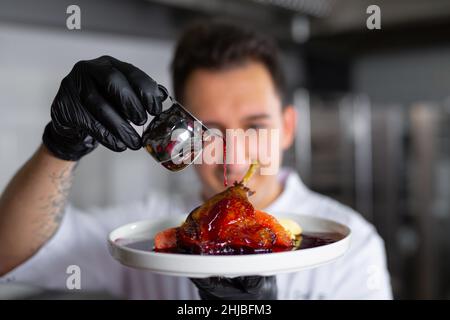 chef preparing ludo in an elite restaurant Stock Photo