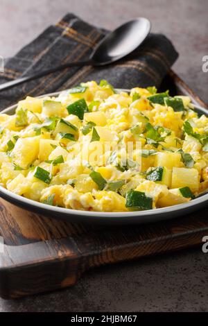 Zarangollo murciano Murcian omelette Spanish cuisine close up in the plate on the table. Vertical Stock Photo