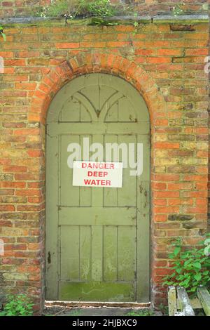 warning sign of deep water on doorway united kingdom Stock Photo