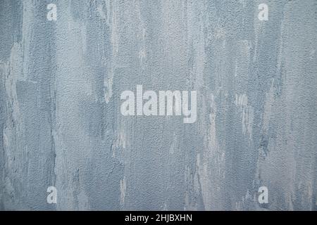 Texture blue gray plastered wall for background. Texture of a gray concrete wall. Rough painted concrete wall texture. Stock Photo