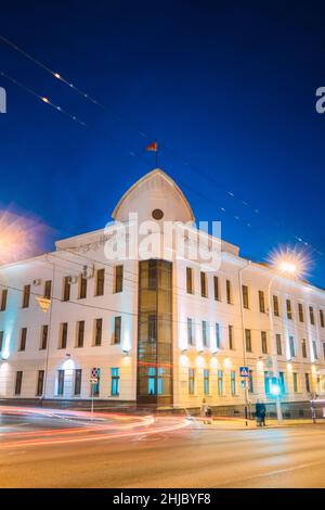 Gomel, Belarus. Building Of Gomel City Executive Committee At Intersection Of Sovetskaya And Krest'yanskaya Streets In Night Illuminations Lights Stock Photo