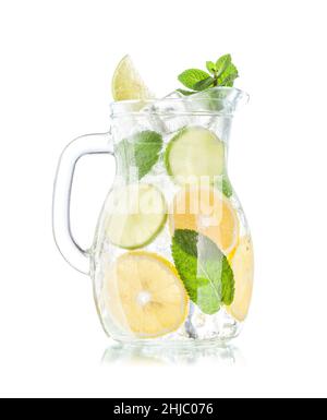 Lemonade pitcher with lemon, mint and ice cubes. Isolated on white background Stock Photo