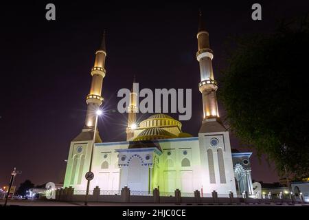 The Al Farooq Omar Bin Al Khattab Mosque, known as Blue Mosque in Dubai, United Arab Emirates, Ottoman style architecture, night view. Stock Photo