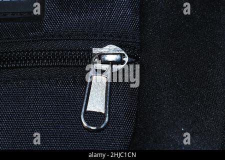 zip close up,beg close up with black background. Stock Photo