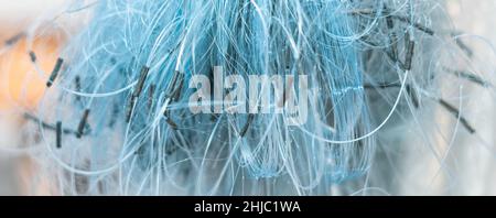 BANNER Abstract real photo white gray pale blue background. Close sail sea fishing tangled line airy mesh texture. Geometric waves circles threads Stock Photo