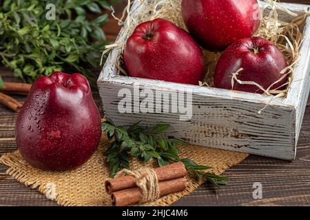 Red apples on a dark, wooden background. Selective focus. Harvesting. Healthy food. copy space. Stock Photo