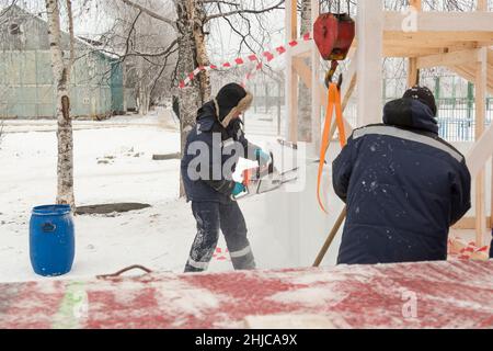 Workman assembler customize chainsaw ice plate Stock Photo