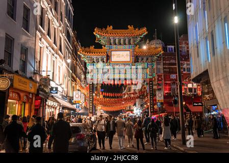 Crowd of people in London's China Town area of Soho at night Stock Photo