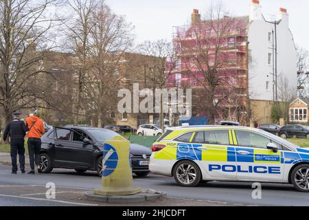 London Greenwich, UK. 28th Jan, 2022. A driver in black car was stopped and appeared to be searched by uniformed police officers near Blackheath village south east London England. Credit: xiu bao/Alamy Live News Stock Photo