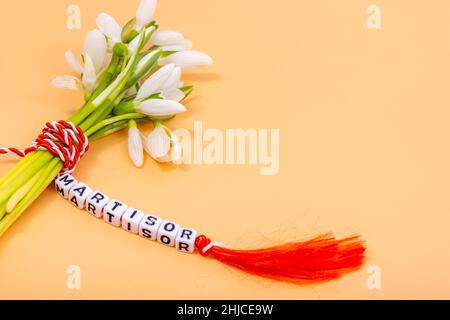 bouquet of snowdrops tied with red and white braided cord, romanian martisor 1st of march tradition Stock Photo