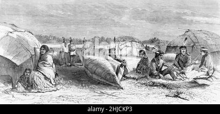 Native Americans in camp with birch-bark wigwams and canoe. Wood engraving from Harper's Weekly, August 5, 1871. Stock Photo