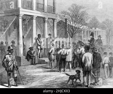 Sale of a freedman to pay his fine, Monticello, Florida. Wood engraving from a sketch by James E. Taylor, Frank Leslie's Illustrated Newspaper, January 19, 1867. During Reconstruction, unfair laws and penalties often forced former slaves into 'debt servitude' to pay off their fines, a form of labor that was little different from slavery. Stock Photo