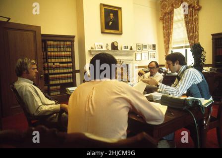 Supreme Court Justice William Rehnquist at work with his law clerks. Stock Photo
