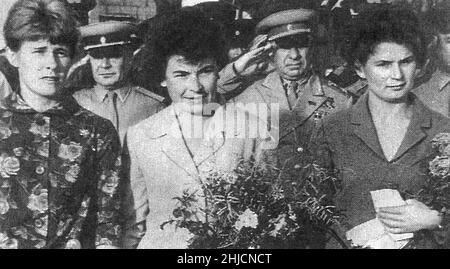 Here are three women cosmonauts at Tyura-Tam prior to the launch of Vostok 6 on June 16, 1963. Left to right are Valentina Ponomareva, backup Irina Solovyeva, and prime crewmember Valentina Tereshkova. Behind the women are State Commission Chairman Georgiy Tyulin (left) and Strategic Missile Forces Commander-in-Chief Sergey Biryuzov. Tereshkova was the first woman in space, spending 3 days aboard Vostok 6. Stock Photo