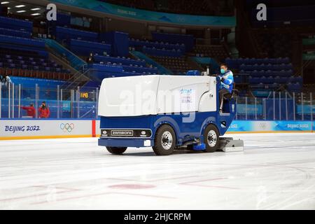 Beijing, China. 26th Jan, 2022. A staff member drives an ice resurfing machine at the National Indoor Stadium in Beijing, China, Jan. 26, 2022. Credit: Du Yu/Xinhua/Alamy Live News Stock Photo