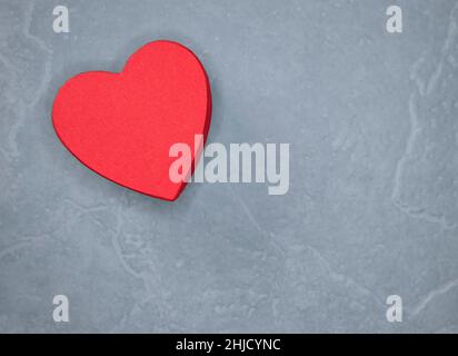 red heart on a light grey background shot from above no people Stock Photo