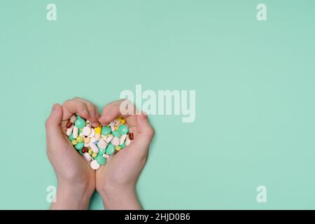 Human hands holding a lot of different pills and capsule. Healthy, medical concept. Stock Photo