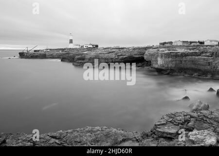 Black and white photo of Portland Bill lighthouse in Dorset at dusk Stock Photo