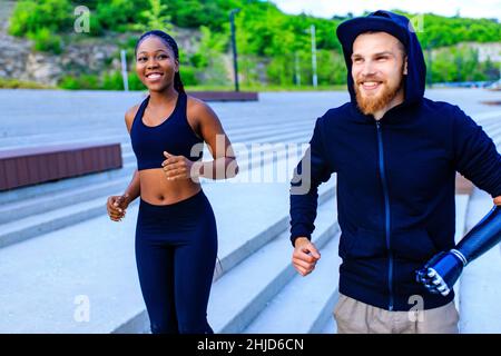 mixed race friends fitness training together outdoors summer morning Stock Photo