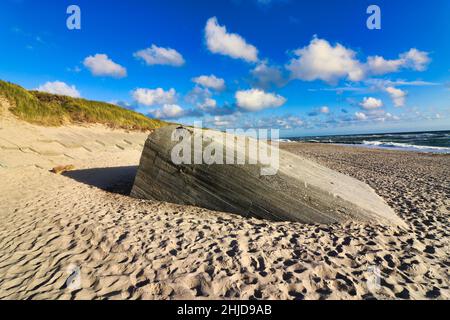 Old concrete bunkers from WWII line the beaches on the west coast of Denmark. The bunkers are part of The Atlantic Wall that was an extensive system o Stock Photo