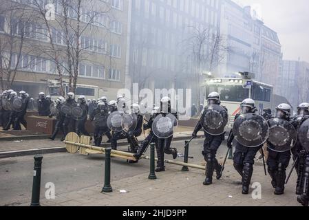 Brussels, Belgium. 23rd Jan, 2022. Anti-riot police patrol the streets during the demonstration.The end of Sunday's demonstration in the Belgium city of Brussels and the heart of the European Union was marred by a small minority only bent on violence. As 50,000 plus demonstrators from all parts of Europe participated in an anti-government coronavirus measures protest which passed without incident. A violent minority clad in black, overran the European District, they vandalized cars, stones were catapulted and thrown and road signs uprooted, the front of the EEAS ''˜European External Actio Stock Photo