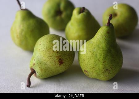 Juicy flavourful green colour pears randomly placed. Isolated shot on white background Stock Photo