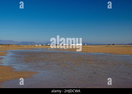 Kite surfing beach in Dahab, Egypt the tide is out, blue skies Stock Photo