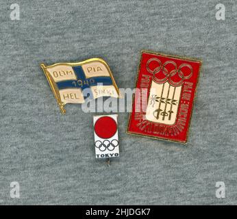 Olympic pins. Three pins from different olympic games. Moscow 1980 and Tokyo 1964. The one from the olympic games with the year 1940 is rare since the olympics this year was cancelled to the ongoing World war II. Now collectable pieces. Stock Photo