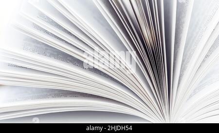 Pages of an open book close-up photography. White pages book side view. The concept of continuing education, visiting libraries, book exhibitions. Stock Photo