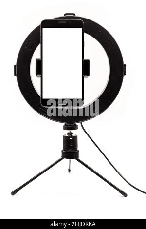 Ring Light template tripe with isolated white background, cellphone filming vertical standing with space for text or photo. Stock Photo