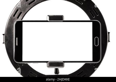Ring Light template tripe with isolated white background, smartphone shooting horizontal with space for text or photo. Stock Photo