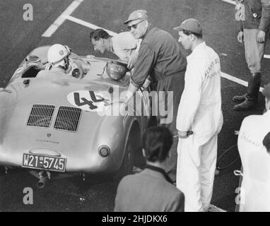 Racing car of the 1950s. The german race car driver Gert Kaiser is pictured in his Porsche 330 spyder during the swedish grand prix that was held in Kristianstad 1958. The man leaning to speak with him is Hans Herrmann, also a famous racingdriver. Stock Photo