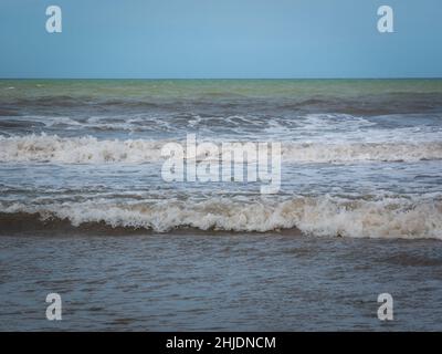 White Spume Known as Sea, Ocean or Beach Foam Created by the Agitation of Seawater in Palomino, Dibulla, La Guajira, Colombia Stock Photo