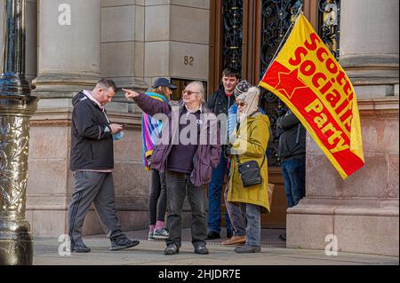 Glasgow, UK. 27th Jan, 2022. Members of the Scotland Socialist Party are seen outside Glasgow City Chambers during the protest.Following the October 23rd protest in 2018, female employees of Glasgow City Council are still having issues with receiving the money owed to them, with some even saying the council is refusing to pay up, the payout tops £500m. Credit: SOPA Images Limited/Alamy Live News Stock Photo