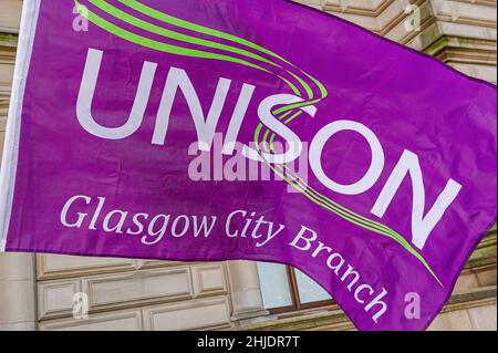 Glasgow, UK. 27th Jan, 2022. A close up view of the Unison union flag during the protest.Following the October 23rd protest in 2018, female employees of Glasgow City Council are still having issues with receiving the money owed to them, with some even saying the council is refusing to pay up, the payout tops £500m. Credit: SOPA Images Limited/Alamy Live News Stock Photo