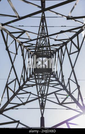 perspective of the interior of a metallic structure, background with abstract straight lines with a blue sky Stock Photo