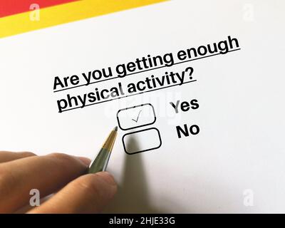 One person is answering question about health problem. The person thinks he gets enough physical activity. Stock Photo