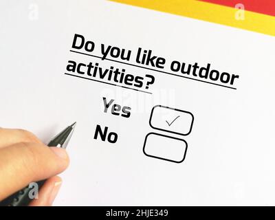 One person is answering question about health problem. The person likes outdoor activities. Stock Photo