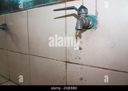 Water drop from faucet Stock Photo