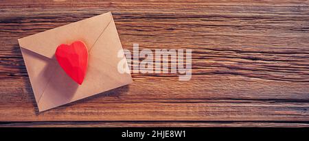 Valentines day texture background. Letter with red wooden heart Stock Photo