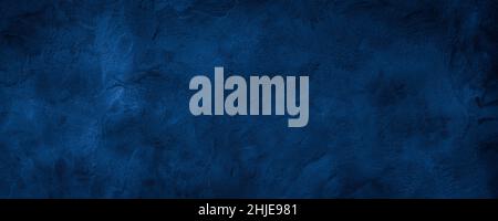 Dark blue rough grainy stone or concrete wall texture background Stock Photo