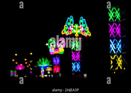 Blured Multi-colored neon lights at night. Stock Photo