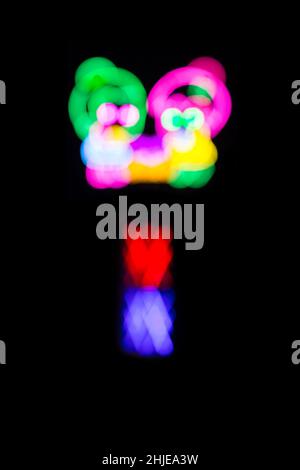 Blured Multi-colored neon lights at night. Stock Photo