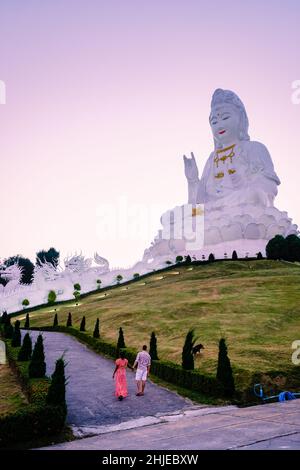 Wat Huay Pla Kung Chiang Rai Thailand during sunset. Wat Huay Pla Kung or Big Buddha Temple in Chiang Rai province North of Thailand, During sunset at dusk, The temple, couple man woman visit temple Stock Photo