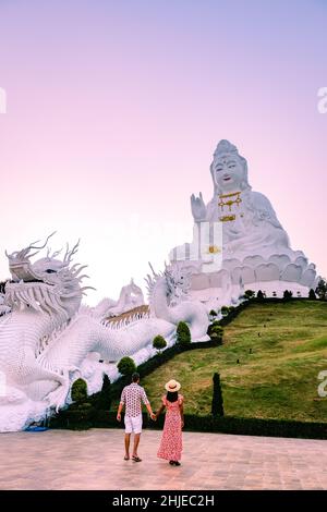 Wat Huay Pla Kung Chiang Rai Thailand during sunset. Wat Huay Pla Kung or Big Buddha Temple in Chiang Rai province North of Thailand, During sunset at dusk, The temple, couple man woman visit temple Stock Photo