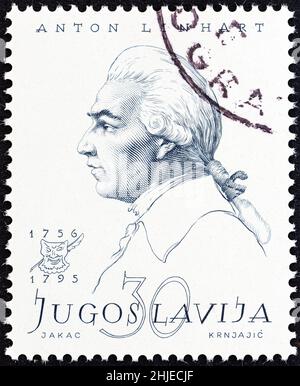 YUGOSLAVIA - CIRCA 1957: A stamp printed in Yugoslavia from the 'Personalities' issue shows Anton Linhart, circa 1957. Stock Photo