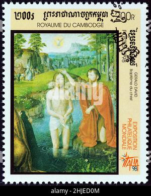 CAMBODIA - CIRCA 1998: A stamp printed in Cambodia shows Baptism of Christ (Gerard David), circa 1998. Stock Photo