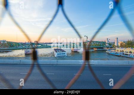 Bangkok / Thailand - December 30 2021: View from Chao Phraya Sky Park, Chao Phraya River close to Phra Pokklao Bridge in, Thonburi, Bangkok, Thailand. Stock Photo