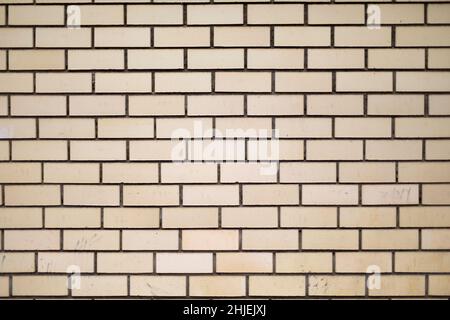 Brick wall. Texture of masonry. Light brick. Repeating elements. Architecture details. Stock Photo